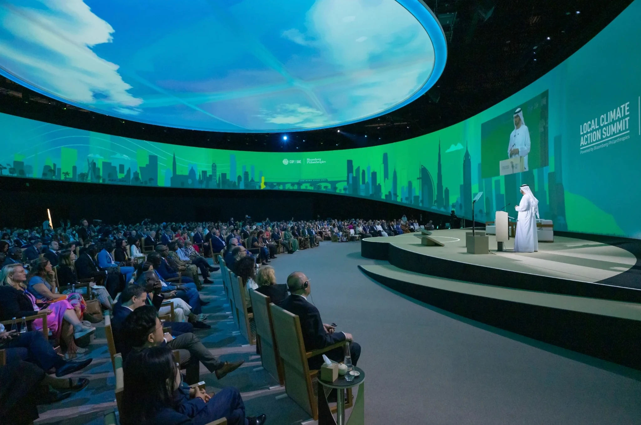 Wide auditorium scene at COP climate event